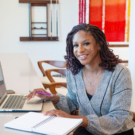 Christine Edwards sitting at a desk